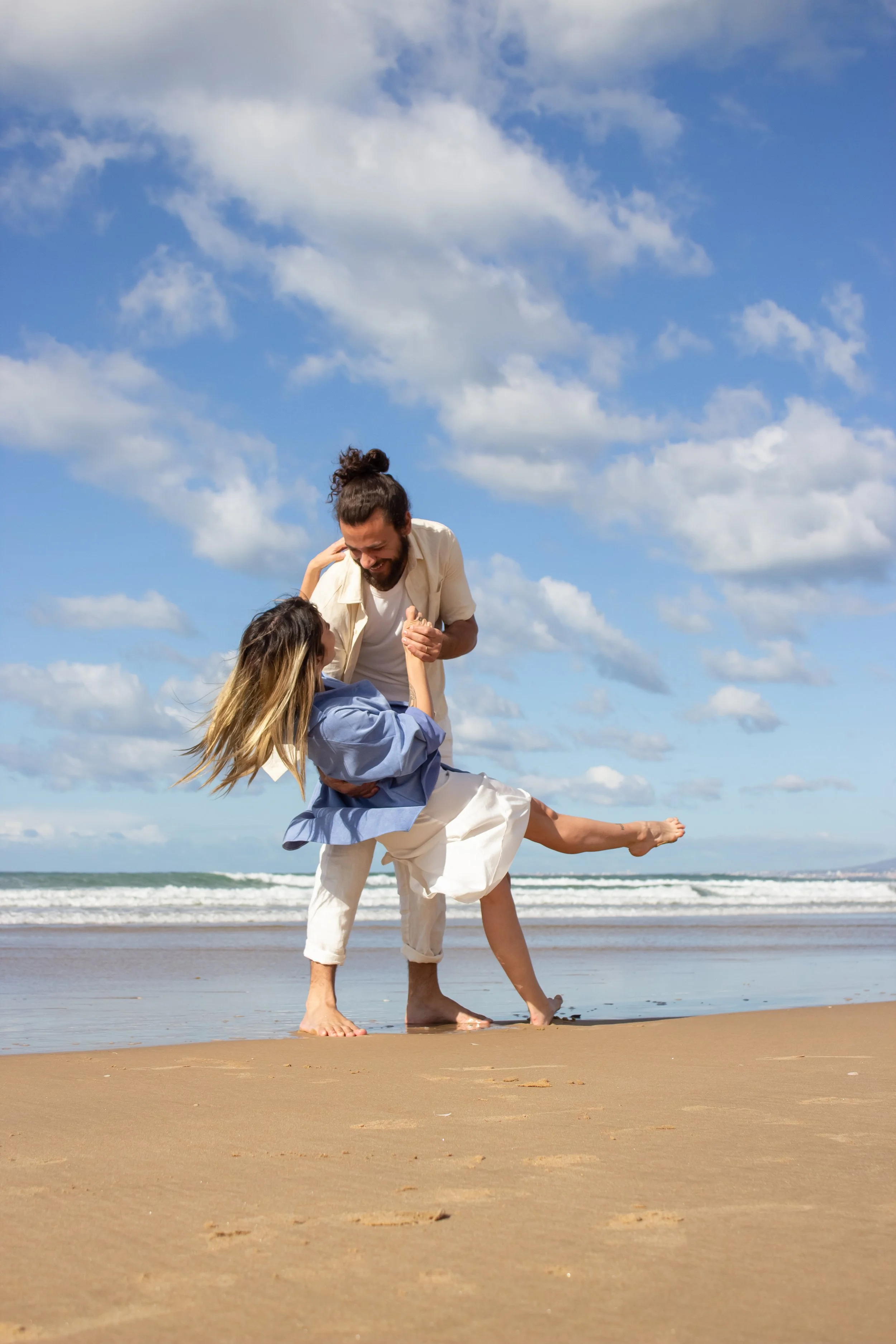 A couple living vibrantly on the beach